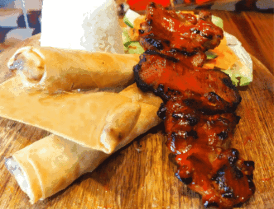 Spring rolls and a pork BBQ skewer